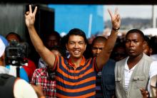 Madagascar's President Andry Rajoelina (C) arrives for presidential candidate Hery Rajaonarimampianina Rakotoarimanana's final campaign rally in the capital Antananarivo, December 18, 2013. PHOTO BY REUTERS/Thomas Mukoya