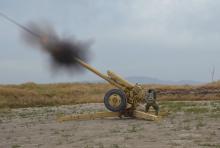 Afghan National Army soldiers fire artillery during a battle with Taliban insurgents in Kunduz, Afghanistan, April 29, 2015. PHOTO BY REUTERS/Stringer