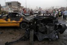 A destroyed vehicle is seen at the site of car bomb attack in Baghdad's Sadr City, August 5, 2015. PHOTO BY REUTERS/Wissm al-Okili 