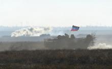An armored carrier, imitating an enemy vehicle, drives during military exercises conducted by Ukrainian armed forces at the Shiroky Lan training ground in Mykolaiv region, Ukraine, in this October 30, 2015 file photo. PHOTO BY REUTERS/Oleksandr Klymenko