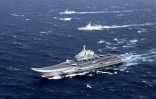 China's Liaoning aircraft carrier with accompanying fleet conducts a drill in an area of South China Sea, December, 2016. PHOTO BY REUTERS/Stringer