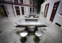 The interior of an unoccupied communal cellblock is seen at Camp VI, a prison used to house detainees at the U.S. Naval Base at Guantanamo Bay, March 5, 2013. PHOTO BY REUTERS/Bob Strong