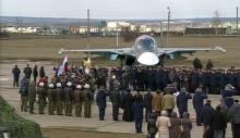 Participants attend a ceremony to welcome Russian military jets and pilots upon their arrival from Syria at an airbase in Buturlinovka in Voronezh region, Russia, in this still image taken from video, March 15, 2016. PHOTO BY REUTERS/Russian Ministry of Defence via