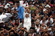 A demonstrator chants slogans while flashing the Oromo protest gesture during celebrations for Irreecha, the thanksgiving festival of the Oromo people, in Bishoftu town, Oromia region, Ethiopia, October 1, 2017. PHOTO BY REUTERS/Tiksa Negeri