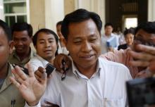 Former Bavet governor Chhouk Bandith walks after appearing at the Court of Appeal in central Phnom Penh, February 27, 2013. PHOTO BY REUTERS/Samrang Pring