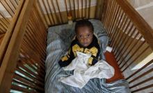 Michelle Sodiki, an abandoned child, rests in his cot at the Don Bosco Ngangi community center in Goma, North Kivu region, August 6, 2013. PHOTO BY REUTERS/Thomas Mukoya