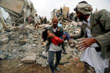 A man carries Buthaina Muhammad Mansour, believed to be four or five, rescued from the site of a Saudi-led air strike that killed eight of her family members in Sanaa, Yemen, August 25, 2017. PHOTO BY REUTERS/Khaled Abdullah