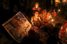 Palestinian children light candles during a rally to remember 18-month-old Palestinian baby Ali Dawabsheh, who was killed after his family's house was set on fire in a suspected attack by Jewish extremists, in Rafah in the southern Gaza Strip, August 2, 2015. PHOTO BY REUTERS/Ibraheem Abu Mustafa