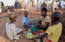 Mozambican child refugees prepare food at Kapise camp in Malawi's Mwanza district, January 18, 2016. PHOTO BY REUTERS/Eldson Chagara