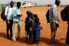 Machiey Mario, 8, Ruai Mario, 10, Nyameer Mario, 6 and Nyawan Mario, 4 (L-R), wait to board a United Nations flight to Juba where they will be reunited with their mother, near Bentiu, South Sudan, February 13, 2017. PHOTO BY REUTERS/Siegfried Modola
