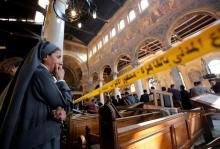 A nun cries as she stands at the scene inside Cairo's Coptic cathedral, following a bombing, in Egypt, December 11, 2016. PHOTO BY REUTERS/Amr Abdallah Dalsh