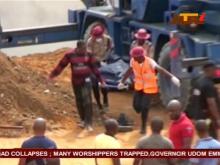 People carry a body on a stretcher after a church collapsed during a service in the southern city of Uyo in Akwa Ibom state, Nigeria in this still image from video, December 10, 2016. PHOTO BY REUTERS TV