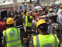 Members of Saudi civil defense try to rescue pilgrims following a crush caused by large numbers of people pushing at Mina, outside the Muslim holy city of Mecca, September 24, 2015. PHOTO BY REUTERS/Directorate of the Saudi Civil Defense