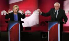 Democratic U.S. presidential candidate and former Secretary of State Hillary Clinton (L) and rival candidate U.S. Senator Bernie Sanders (R) speak simultaneously at the NBC News - YouTube Democratic presidential candidates debate in Charleston, South Carolina, January 17, 2016. PHOTO BY REUTERS/Randall Hill