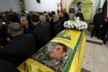 People offer their condolences near the coffin of Lebanese Hezbollah militant leader Samir Qantar during his funeral in Beirut's southern suburbs, Lebanon, December 21, 2015. PHOTO BY REUTERS/Jamal Saidi