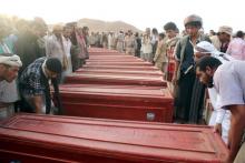 Relatives gather around coffins of Yemeni troops killed by Saudi-led air strikes on an army base that was hit in error, during their funeral procession in al-Abr on the border with Saudi Arabia, July 11, 2015. PHOTO BY REUTERS/Stringer