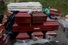 New coffins for reburials, are seen in a cemetery after flooding and mudslides caused by heavy rains leading several rivers to overflow, pushing sediment and rocks into buildings and roads, in Mocoa, Colombia, April 3, 2017. PHOTO BY REUTERS/Jaime Saldarriaga