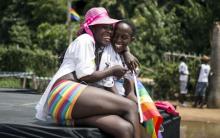ENTEBBE, Uganda (Reuters) - Several dozen Ugandans marked Gay Pride on Saturday, cheering that such a parade could go ahead in a country that only last year tried to impose long jail terms for gay sex.  At a secluded beach in Entebbe, on Lake Victoria just outside the capital Kampala, a group of about 70 people holding banners including "I have a relationship with Jesus and I'm gay", marched a short distance as music blared out.  Gays and lesbians in Ugandans often live secretive lives, fearful that coming 