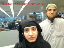 Tashfeen Malik, (L), and Syed Farook are pictured passing through Chicago's O'Hare International Airport in this July 27, 2014 handout photo obtained by Reuters December 8, 2015. PHOTO BY REUTERS/US Customs and Border Protection