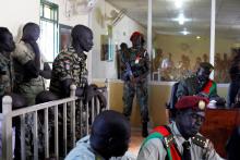 South Sudanese soldiers stand during their sentencing over the rape of foreign aid workers and the murder of a local journalist in an assault on the Terrain Hotel in the capital Juba in 2016 at a military court Juba, South Sudan, September 6, 2018. PHORO BY REUTERS/Andreea Campeanu