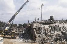 A crane is brought in after the explosion of the Marine Corps building in Beirut, Lebanon, October 23, 1983. PHOTO BY REUTERS/US Marines