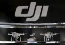 Drones are displayed inside DJI's first flagship store of DJI in Shenzhen, China December 18, 2015, two days before it's official opening. PHOTO BY REUTERS/Bobby Yip