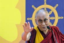 Exiled Tibetan spiritual leader, the Dalai Lama, addresses a gathering with the theme "A Human Approach to Peace and the Individual" at a stadium in the northeastern Indian city of Guwahati