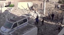 People gather near what is said to be a hospital damaged by missile attacks in Azaz, Aleppo, Syria, February 15, 2016 in this still image taken from a video on a social media website. PHOTO BY REUTERS/Social Media Website via Reuters TV