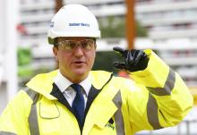 Britain's Prime Minister David Cameron points during a visit to a construction site in central London