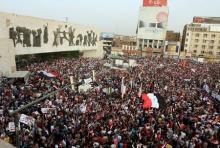 People shout slogans during a demonstration against corruption and poor services in regard to power cuts and water shortages, at Tahrir Square in central Baghdad, Iraq, August 7, 2015. PHOTO BY REUTERS/Stringer
