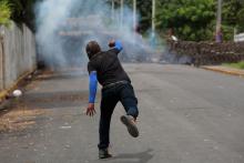 A demonstrator throws a homemade device during the funeral service of Jose Esteban Sevilla Medina, who died during clashes with pro-government supporters in Monimbo, Nicaragua, July 16, 2018. PHOTO BY REUTERS/Oswaldo Rivas