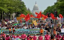 Demonstrators march down Pennsylvania Avenue during a People's Climate March, to protest U.S. President Donald Trump's stance on the environment, in Washington, U.S., April 29, 2017. PHOTO BY REUTERS/Mike Theiler