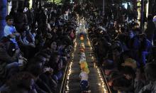 Demonstrators light candles in memory of the mine victims during a sit-in protest in Istanbul