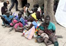 Residents displaced due to the fighting between government and rebel forces in the Upper Nile capital Malakal wait at a World Food Program (WFP) outpost where thousands have taken shelter in Kuernyang Payam, South Sudan May 2, 2015. PHOTO BY REUTERS/Denis Dumo