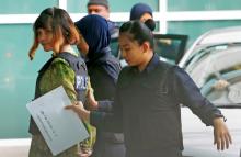 Vietnamese Doan Thi Huong who is on trial for the killing of Kim Jong Nam, the estranged half-brother of North Korea's leader, is escorted as she arrives at the Department of Chemistry in Petaling Jaya, near Kuala Lumpur, Malaysia, October 9, 2017. PHOTO BY REUTERS/Lai Seng Sin