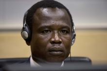 Dominic Ongwen, a commander of the Ugandan Lord's Resistance Army (LRA), waits for the judge to arrive, during his first appearance at the International Criminal Court in The Hague, Netherlands, January 26, 2015. PHOTO BY REUTERS/Peter Dejong