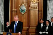 Waiters hold U.S. President Donald Trump's Diet Coke as he delivers remarks before his toast to Japan's Prime Minister Shinzo Abe during an official dinner in Trump's honor at Akasaka Palace in Tokyo, Japan November 6, 2017. PHOTO BY REUTERS/Jonathan Ernst