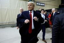 Donald Trump arrives at the Republican caucus site at the 7 Flags Event Center in Clive, Iowa, February 1, 2016. PHOTO BY REUTERS/Jim Bourg