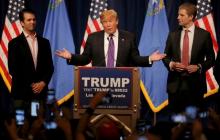 Republican U.S. presidential candidate Donald Trump is flanked by his sons Donald Trump Jr. (L) and Eric Trump (R) as he addresses supporters after being declared by the television networks as the winner of the Nevada Republican caucuses at his caucus night rally in Las Vegas, Nevada, February 23, 2016. PHOTO BY REUTERS/Jim Young