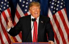 Republican U.S. presidential candidate Donald Trump responds to a speech attacking his candidacy by former Republican presidential nominee Mitt Romney as Trump appears at a campaign rally in Portland, Maine, March 3, 2016. PHOTO BY REUTERS/Joel Page