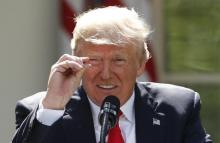 President Trump refers to amounts of temperature change as he announces his decision that the United States will withdraw from the landmark Paris Climate Agreement. PHOTO BY REUTERS/Kevin Lamarque