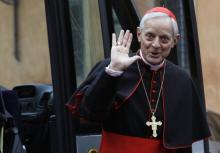 Cardinal Donald William Wuerl from U.S. waves as he arrives for a meeting at the Synod Hall in the Vatican, March 7, 2013. PHOTO BY REUTERS/Alessandro Bianchi