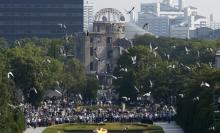 Doves fly over the Peace Memorial Park with the Atomic Bomb Dome in the background, at a ceremony in Hiroshima, western Japan, August 6, 2015, on the 70th anniversary of the atomic bombing of the city. PHOTO BY REUTERS/Toru Hanai