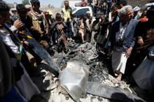 People gather around the engine of a drone aircraft which the Houthi rebels said they have downed in Sanaa, Yemen, October 1, 2017. PHOTO BY REUTERS/Khaled Abdullah