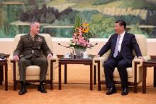 U.S. Chairman of the Joint Chiefs of Staff Gen. Joseph Dunford chats with President Xi Jinping during a meeting at the Great Hall of the People in Beijing, China, August 17, 2017. PHOTO BY REUTERS/Andy Wong