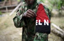 A rebel of Colombia's Marxist National Liberation Army (ELN) shows his armband while posing for a photograph, in the northwestern jungles, Colombia, August 31, 2017. PHOTO BY REUTERS/Federico Rios