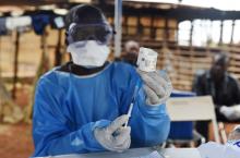 A Congolese health worker prepares to administer Ebola vaccine, outside the house of a victim who died from Ebola in the village of Mangina in North Kivu province of the Democratic Republic of Congo, August 18, 2018. PHOTO BY REUTERS/Olivia Acland