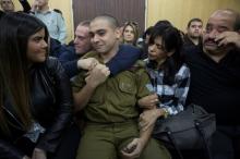 Israeli soldier Elor Azaria, who is charged with manslaughter by the Israeli military, sits to hear his verdict in a military court in Tel Aviv, Israel, January 4, 2017. PHOTO BY REUTERS/Heidi Levine
