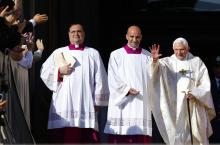 Emeritus Pope Benedict XVI waves as he arrives to attend a mass for the beatification of former pope Paul VI in St. Peter's square at the Vatican October 19, 2014. PHOTO BY REUTERS/Tony Gentile