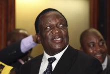 Newly appointed Zimbabwean Deputy President Emmerson Mnangagwa smiles at the headquarters of President Robert Mugabe's ZANU (PF) in Harare, December 10, 2014. PHOTO BY REUTERS/Philimon Bulawayo